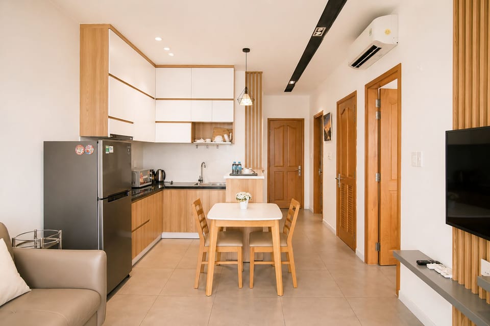 Deluxe Apartment, 2 Bedrooms, City View | Living area | 50-inch LCD TV with satellite channels