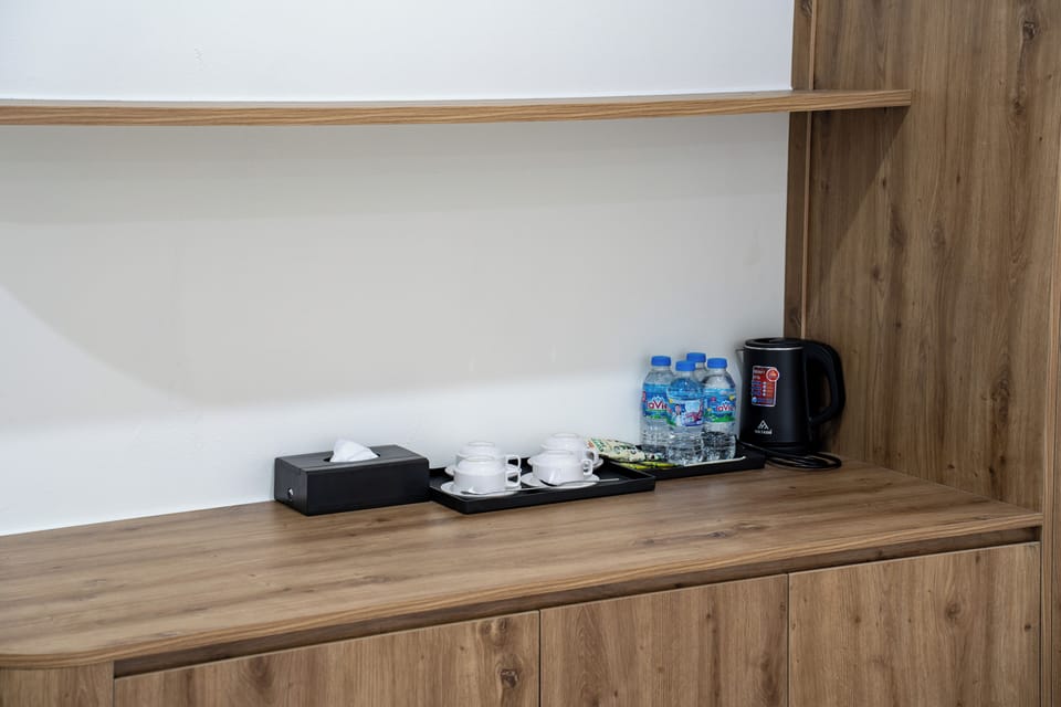 Executive Quadruple Room, City View | Minibar, desk, laptop workspace, blackout drapes