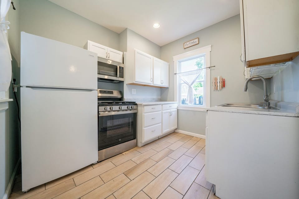 Cook up a feast with sleek stainless appliances and a chef-ready gas range.