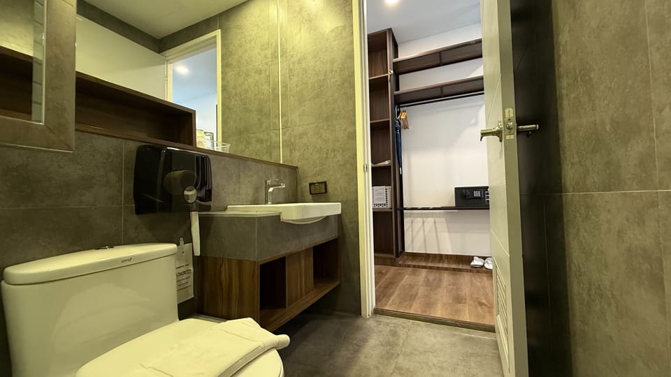 Pool Access B | Bathroom | Shower, hair dryer, slippers, towels