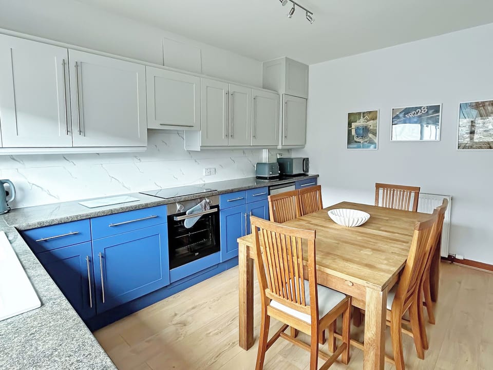 Kitchen view towards door | Broadsea Cottage, Fraserburgh