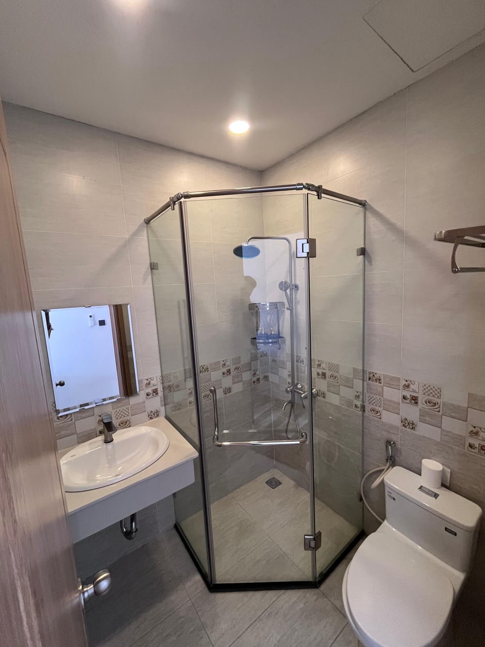Shower, rainfall showerhead, designer toiletries, hair dryer