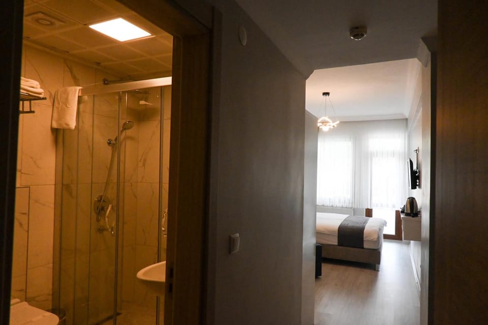 Standard Double Room, Balcony, City View | Bathroom | Shower, rainfall showerhead, hair dryer, slippers