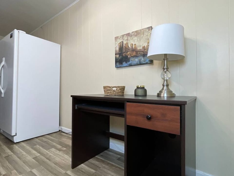 ✨ Function meets convenience. A spacious fridge and a sleek desk.