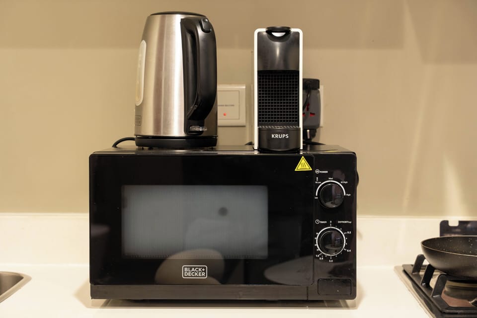 Deluxe Apartment, Balcony, Lake View | Private kitchen | Espresso maker, coffee/tea maker, full-size fridge, microwave