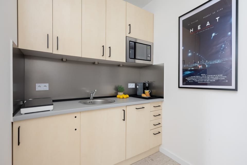 Functional kitchenette integrated with the seating area.