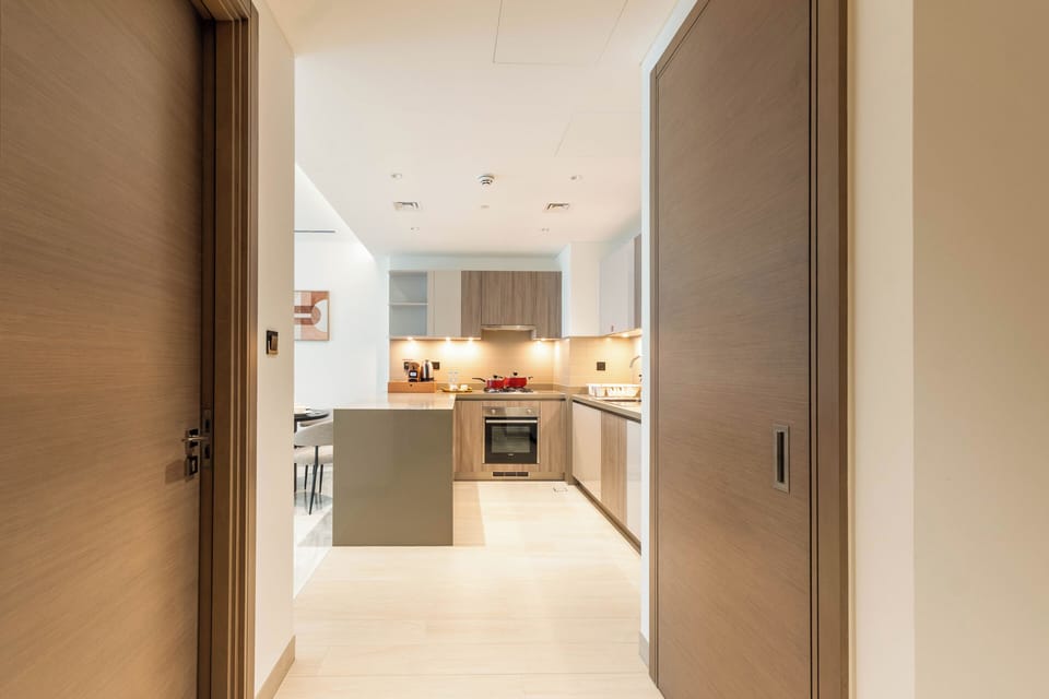 Deluxe Apartment, Balcony, Pool View | Private kitchen | Coffee/tea maker, full-size fridge, microwave, oven