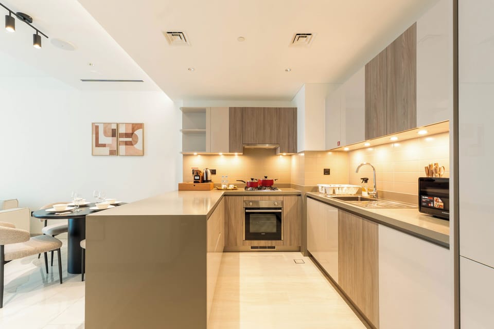 Deluxe Apartment, Balcony, Pool View | Private kitchen | Full-size fridge, microwave, oven, stovetop