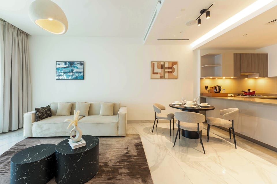 Deluxe Apartment, Balcony, Pool View | Living area | 57-inch flat-screen TV with satellite channels