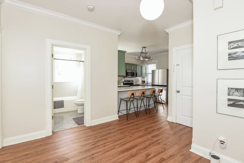 View of kitchen from entryway with breakfast bar.