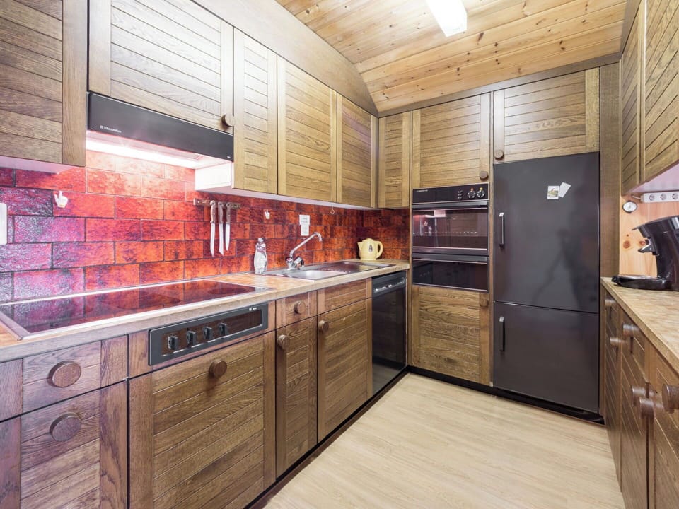 Wood, Kitchen, Interior Design, Flooring, Countertop, Cabinetry, Wood Stain, Ceiling, Light Fixture, Wood Flooring