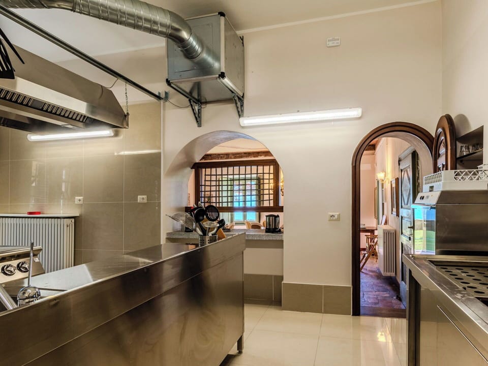 Interior Design, Ceiling, Lighting, Kitchen, Flooring, Countertop, Kitchen Appliance, Major Appliance, Light Fixture, Cabinetry