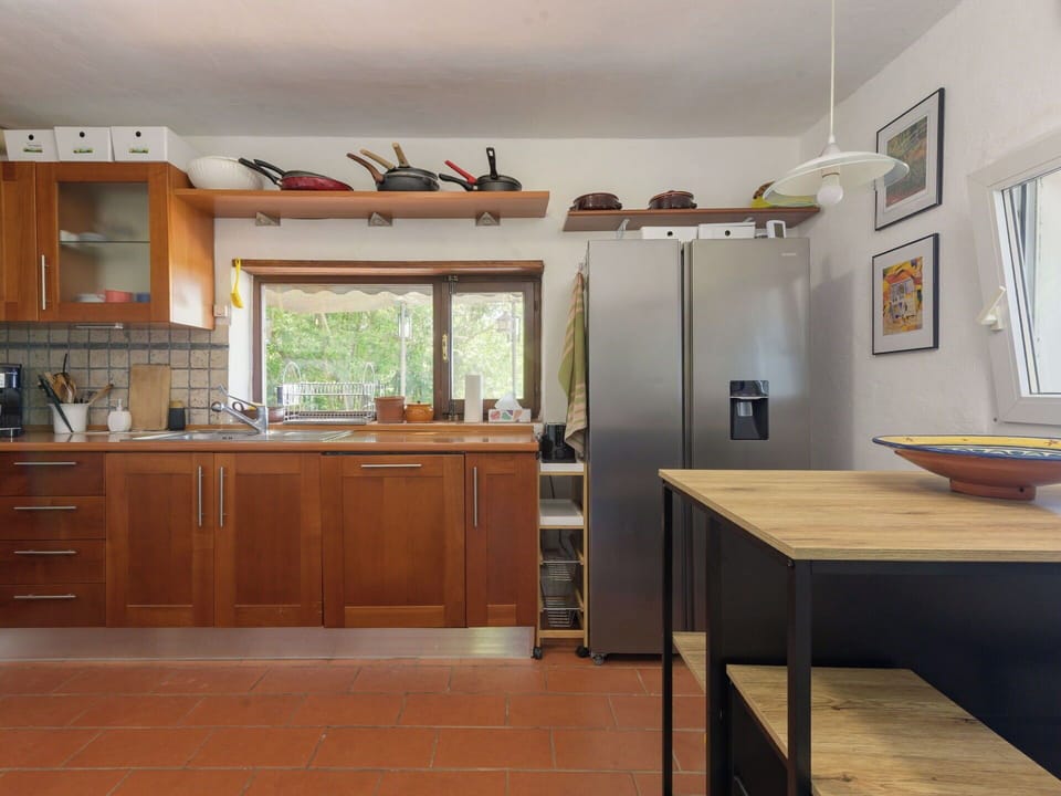 Furniture, Kitchen, Kitchen Appliance, Countertop, Flooring, Cabinetry, Interior Design, Major Appliance, Wood, Floor