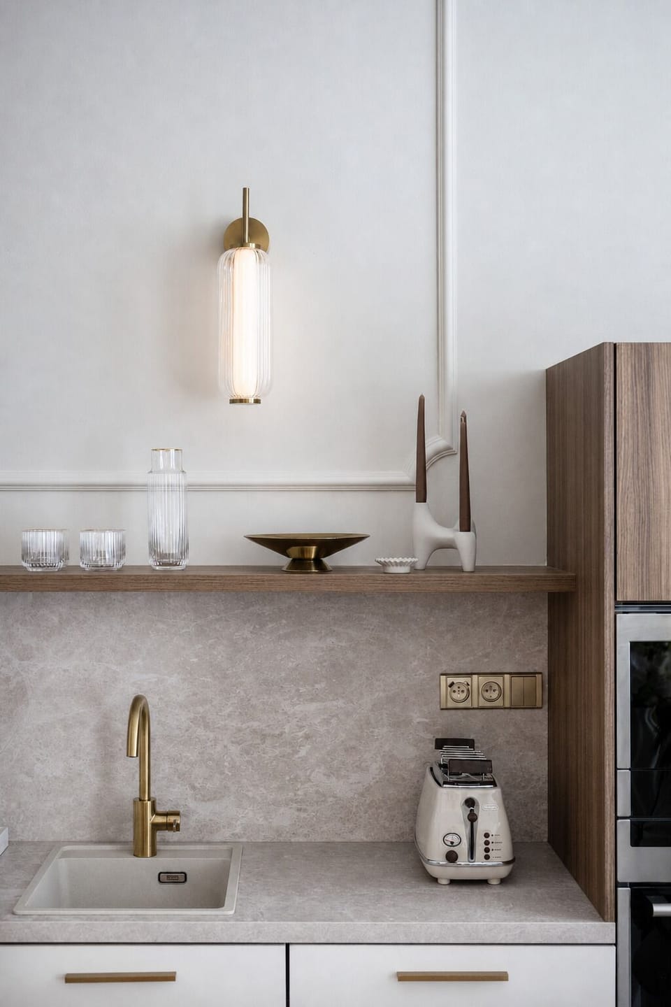 Elegant minimalist kitchen with brass accents and designer details