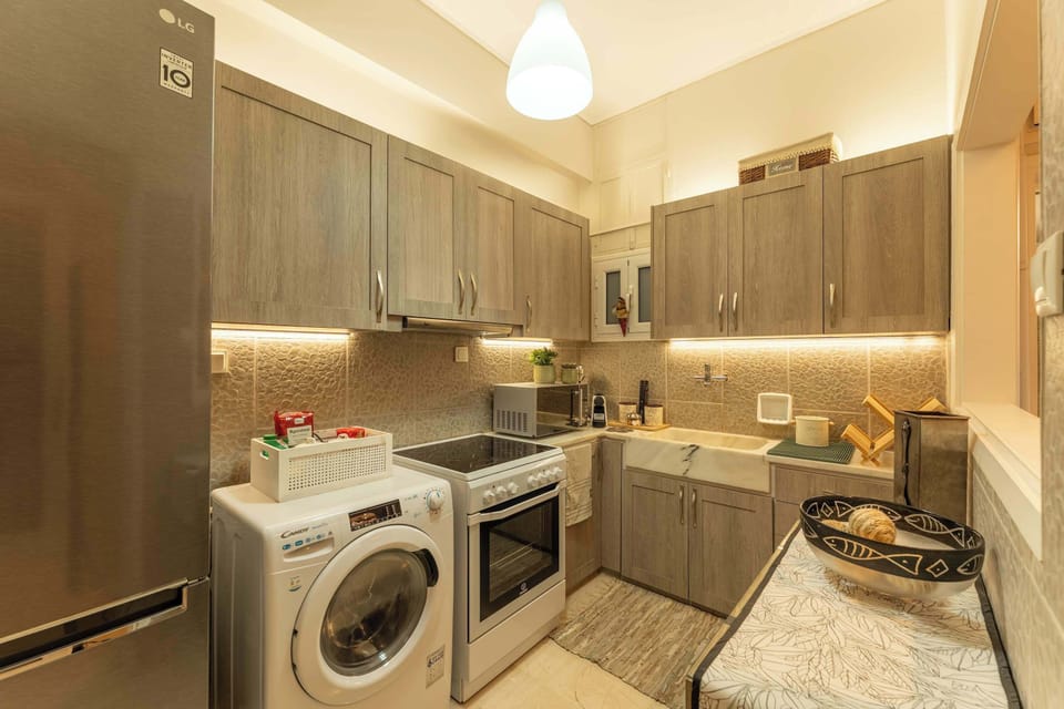A contemporary, fully equipped kitchen with warm lighting and refined finishes, offering everything needed for effortless stays beside Marina Zeas.