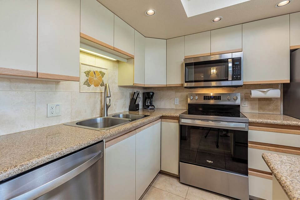 Your fully-equipped kitchen awaits, ready for everything from morning coffee to home-cooked feasts. Modern appliances, ample counter space, and bright lighting create a welcoming space to cook and gather.