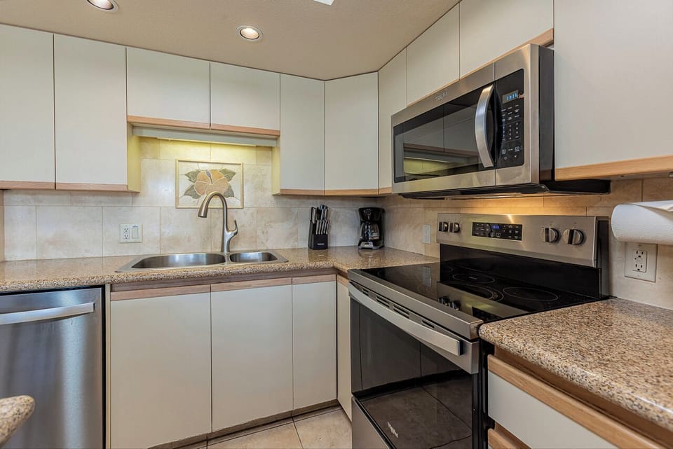 Your fully equipped kitchen features modern stainless steel appliances, perfect for preparing home-cooked meals during your stay.