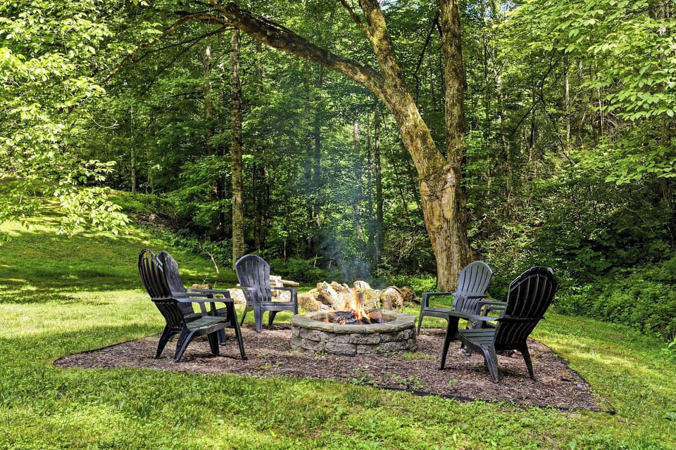 Gather around the stone fire pit surrounded by forest views, perfect for evening s'mores and storytelling under the trees.