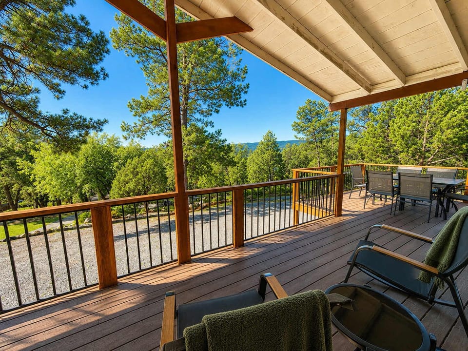 Enjoy a relaxing view from the covered front porch and outdoor dining area.