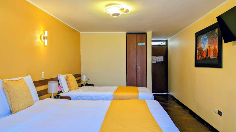 Desk, laptop workspace, free WiFi, bed sheets