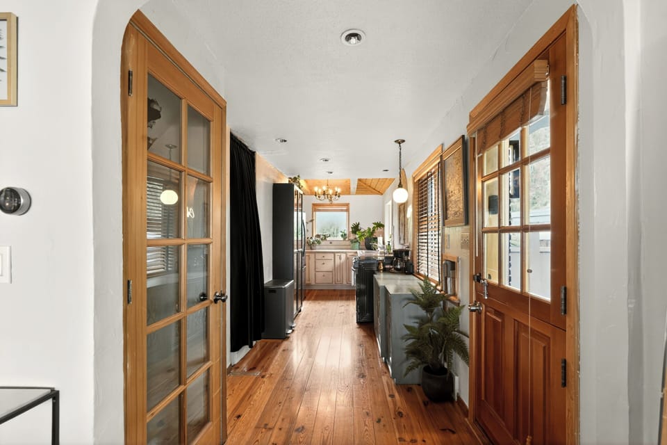 Charming wood-lined hallway with bright natural light and stylish details