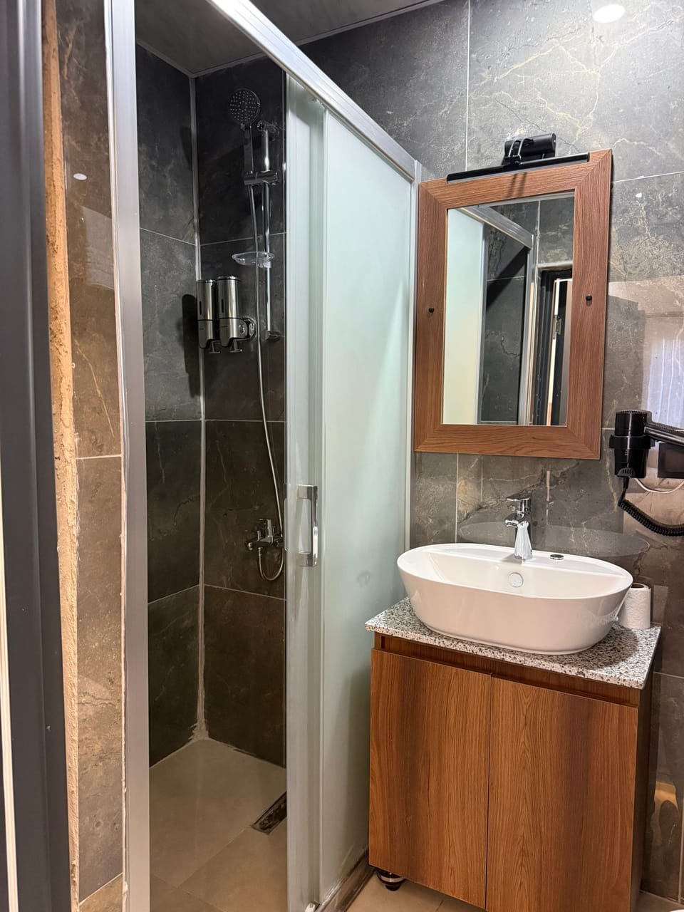 Family Triple Room | Bathroom | Shower, hair dryer, towels, soap