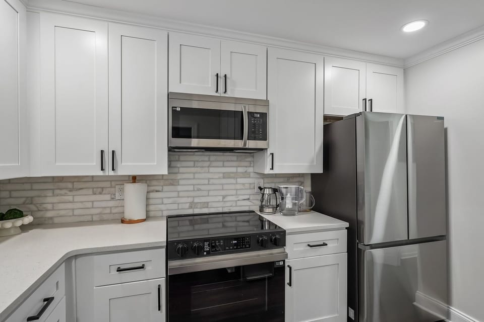 Kitchen - Fully equipped +stainless steel cookware +Dinnerware and Glassware for 8 +Air Fryer +Blender +Mixing bowls +Mixer +Toaster +Rice Maker +Coffee & Tea Bar +Baking Pans +Kitchen Utility & Measurement Tools +Storage bowls