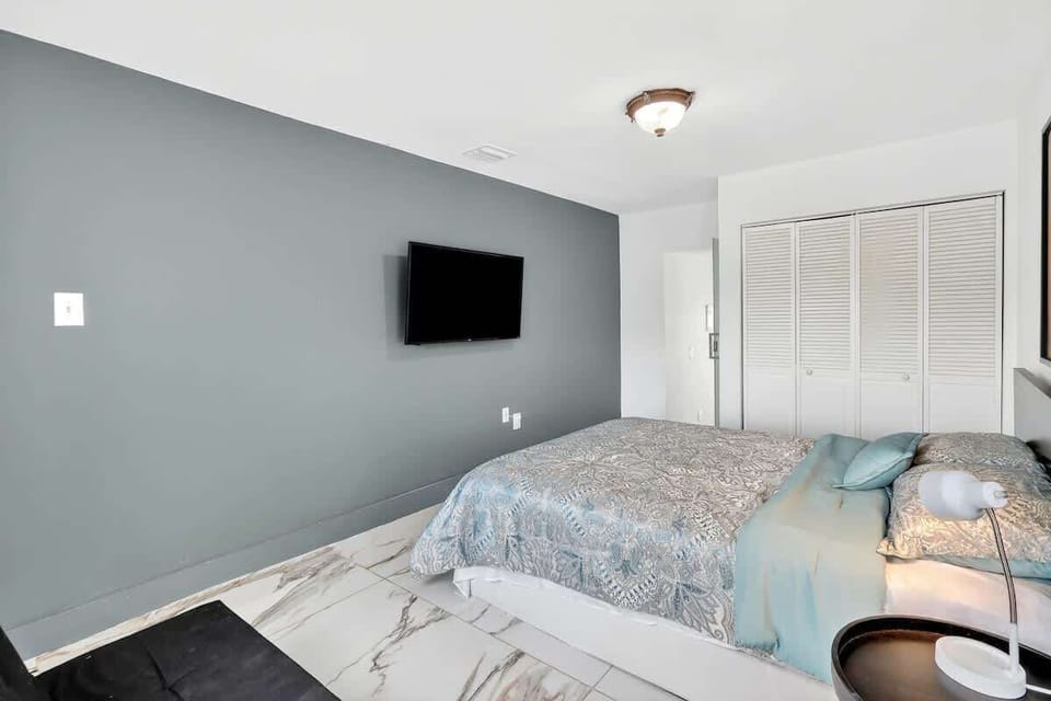 Comfortable queen bed with hotel-quality linens for a restful night's sleep