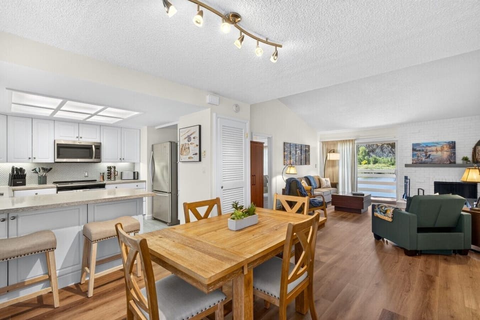 View of living room, dining room, and kitchen