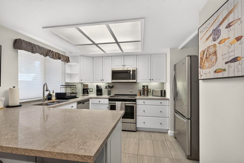 Bright kitchen with stainless steel appliances