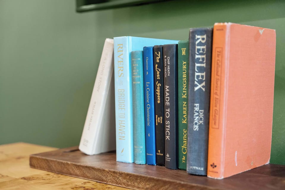 Bookshelf with a selection of books and decorative display