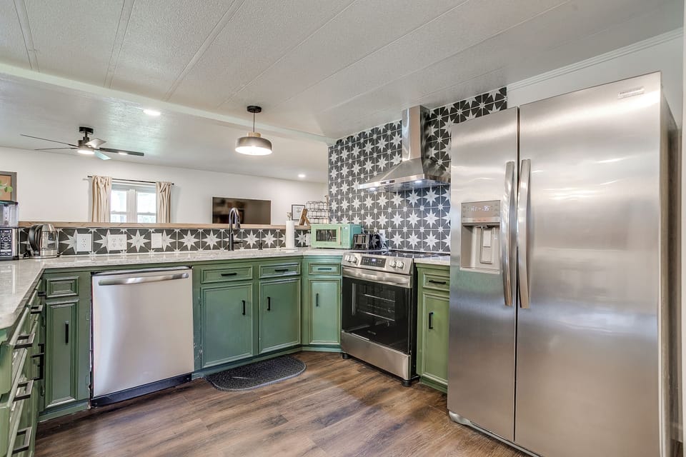The kitchen includes guest-use basics for cooking, serving, and enjoying meals.
