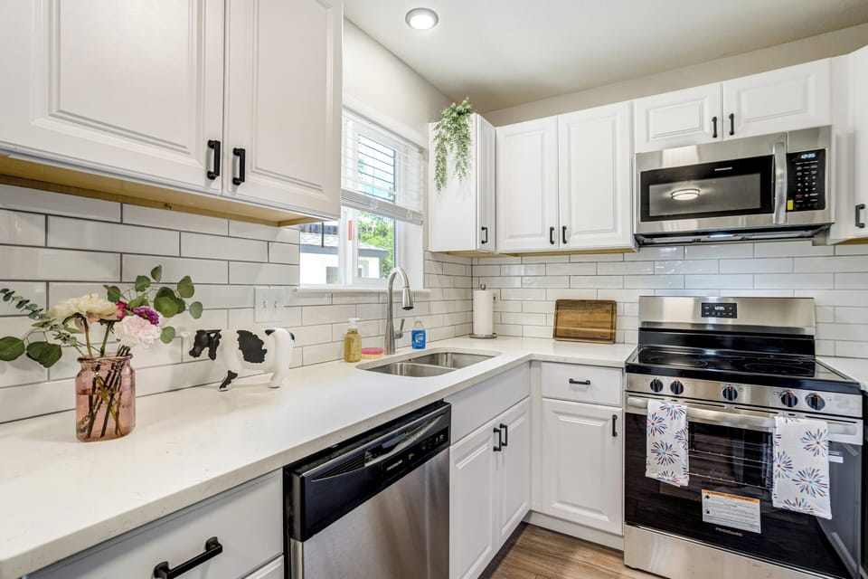 The updated kitchen is fully equipped for both short and extended stays and includes a Keurig coffee maker to help start your mornings right.