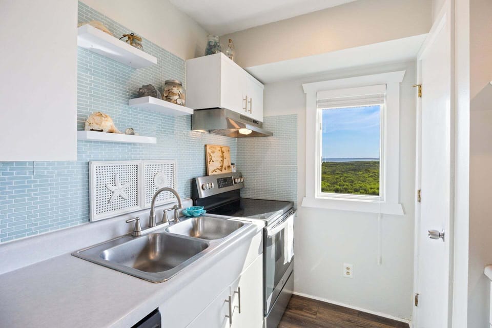 The fully equipped kitchen makes preparing vacation meals simple and convenient.