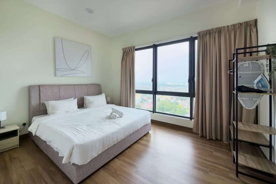 The spacious master bedroom with a king-sized bed and an en-suite.