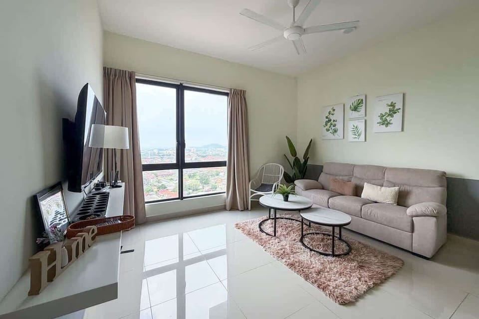 The bright & airy living area with a 3-seater couch.