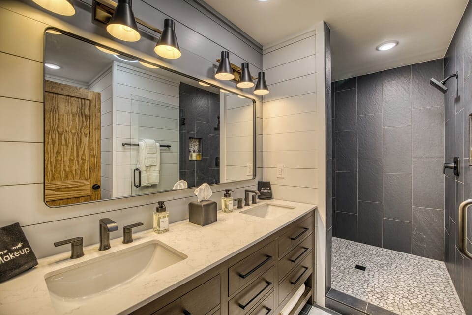 Spa-like bathroom with double vanity and sleek walk-in shower