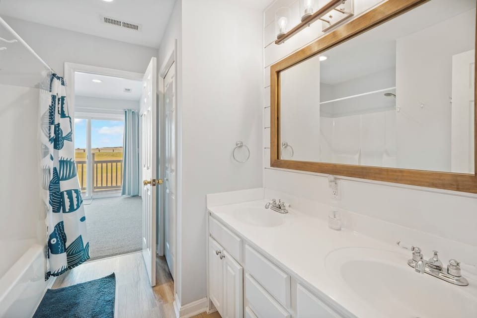 The Primary Full Bath is attached, and has a double vanity and tub/shower combo.