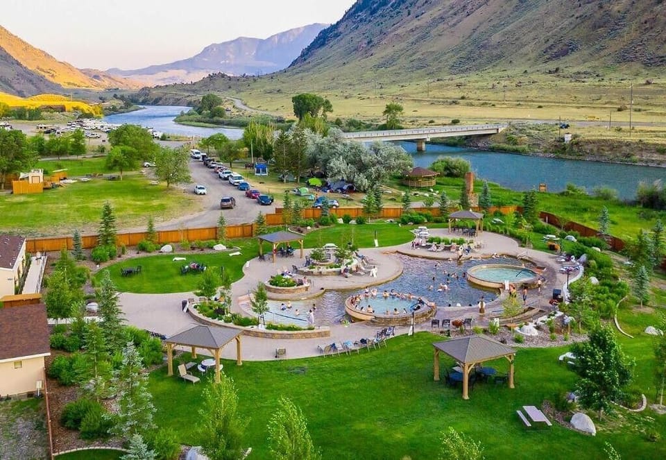 Soak together in sprawling riverside pools with mountain views.