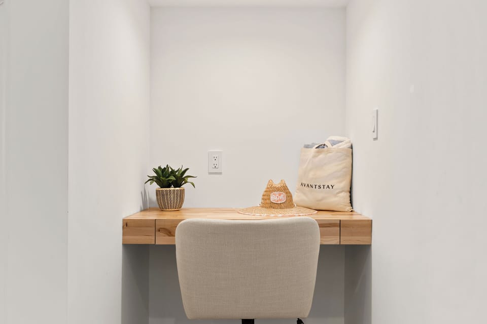 Alternate view of the minimalist built-in office desk area, showcasing its clean lines and space-saving design.