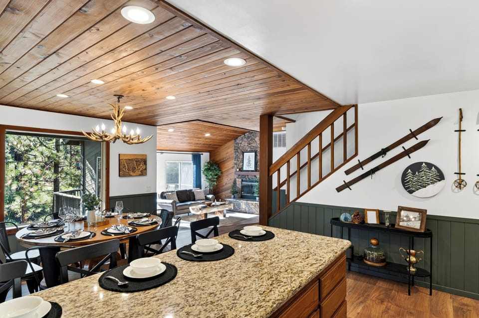 Full kitchen with granite counters, ample cabinetry, and easy cabin-style charm.