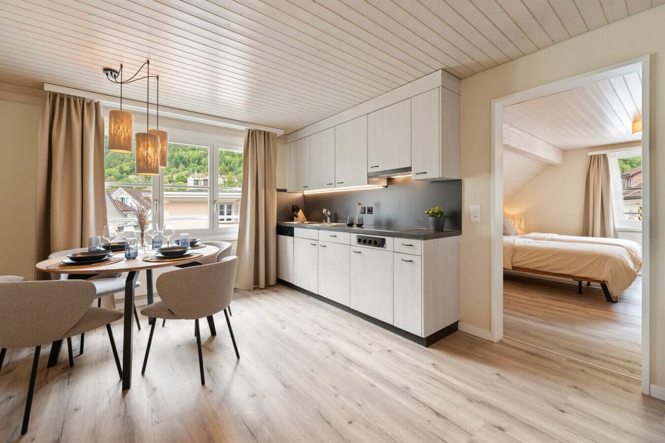 Enjoy a bright and thoughtfully designed space with a separate cozy bedroom, modern kitchen, and inviting dining area for relaxing stays.