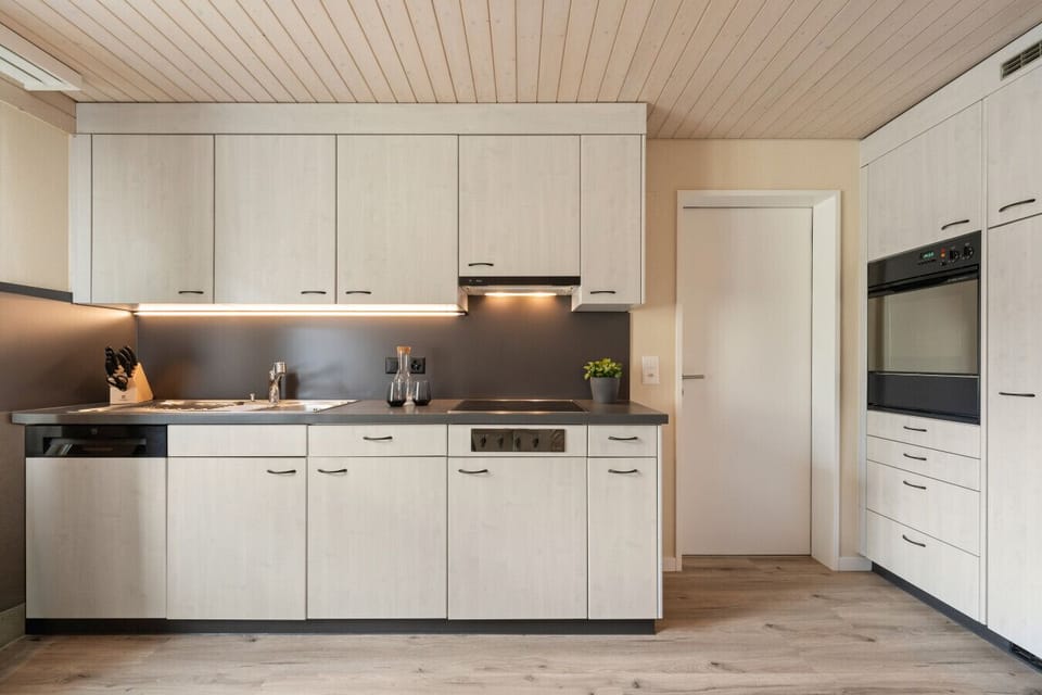Cook with ease in your modern fully equipped kitchen featuring premium appliances, generous workspace, and everything you need for your stay.