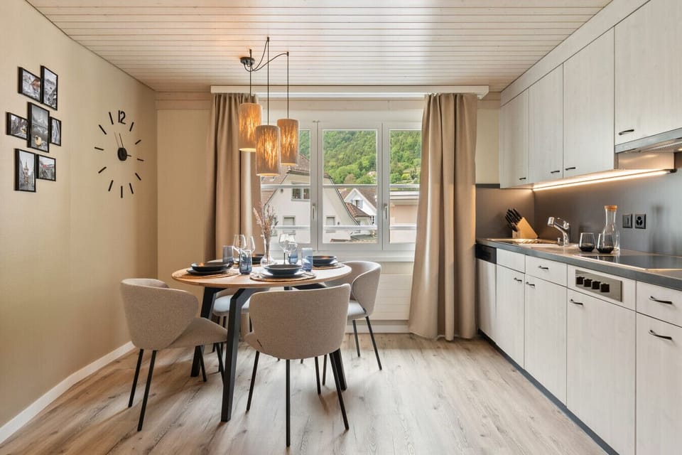 Enjoy slow breakfasts and cozy dinners in your bright, fully equipped kitchen with elegant dining area and peaceful mountain views right outside your window.