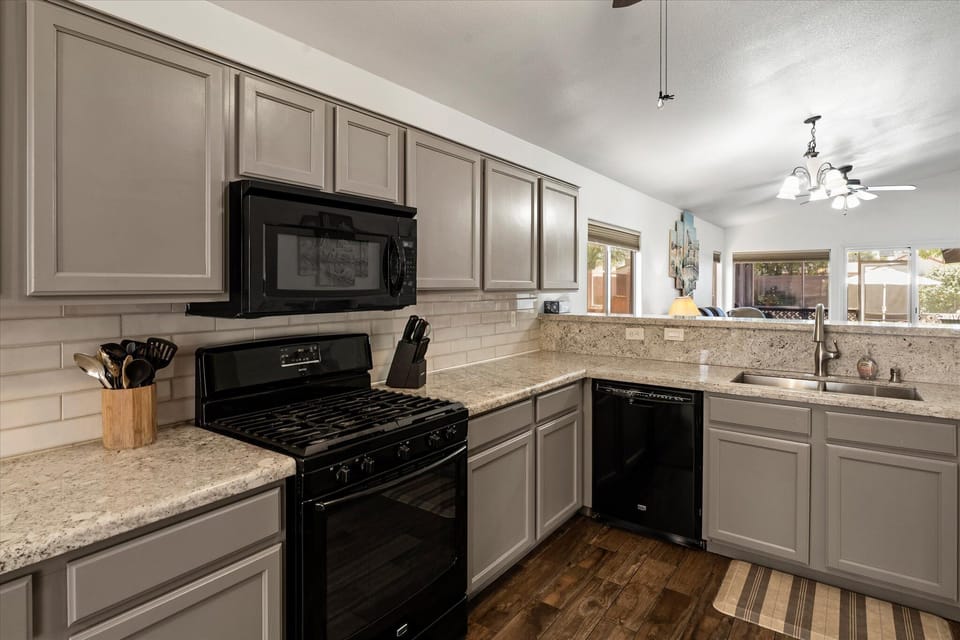 Cook, snack, and gather in the fully equipped kitchen with everything you need for an easy Arizona stay.