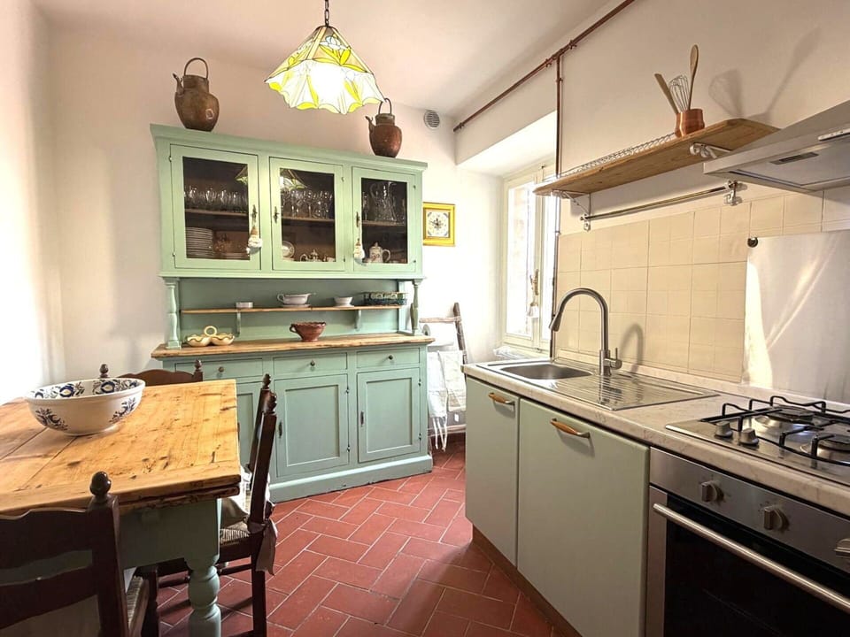 Furniture, Kitchen, Countertop, Cabinetry, Interior Design, Flooring, Wood, Kitchen Appliance, Floor, Room