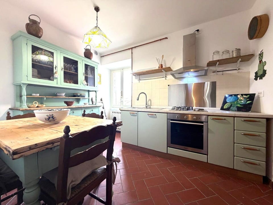 Furniture, Kitchen, Flooring, Interior Design, Countertop, Wood, Cabinetry, Kitchen Appliance, Floor, Room