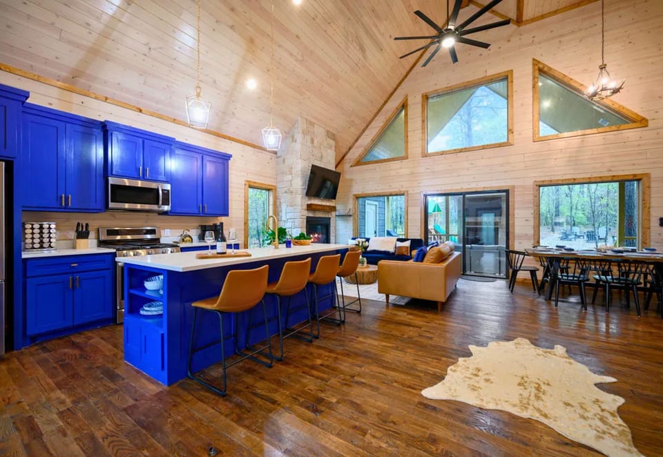 Natural light, soaring ceilings, and comfortable furnishings create an inviting living space where everyone can relax together after a day of exploring.