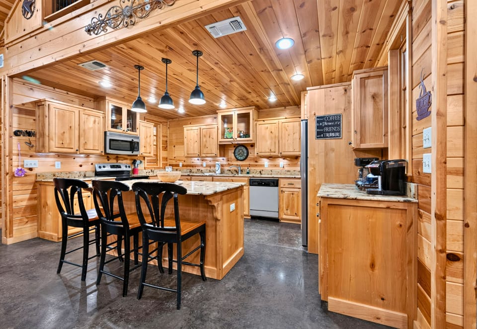 The open floor plan creates a welcoming atmosphere where cooking, dining, and relaxing all come together in one comfortable space.