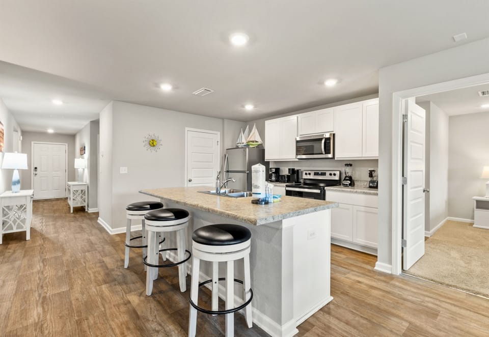 Open-concept living with kitchen, dining, and lounging all connected for family togetherness.